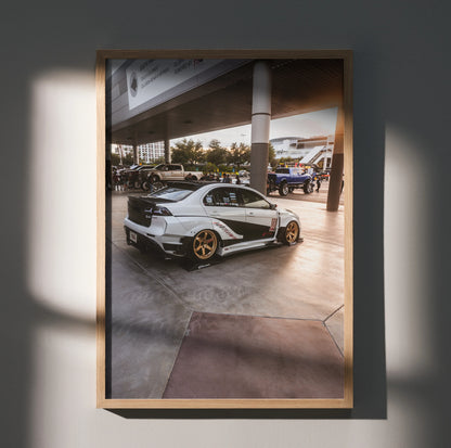 Mitsubishi Evo 10 parked under overhang with modern building background poster wall art.