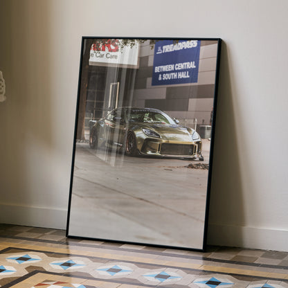 Subaru BRZ poster wall art featuring a high-resolution photo of a gold BRZ sports car in a garage setting.