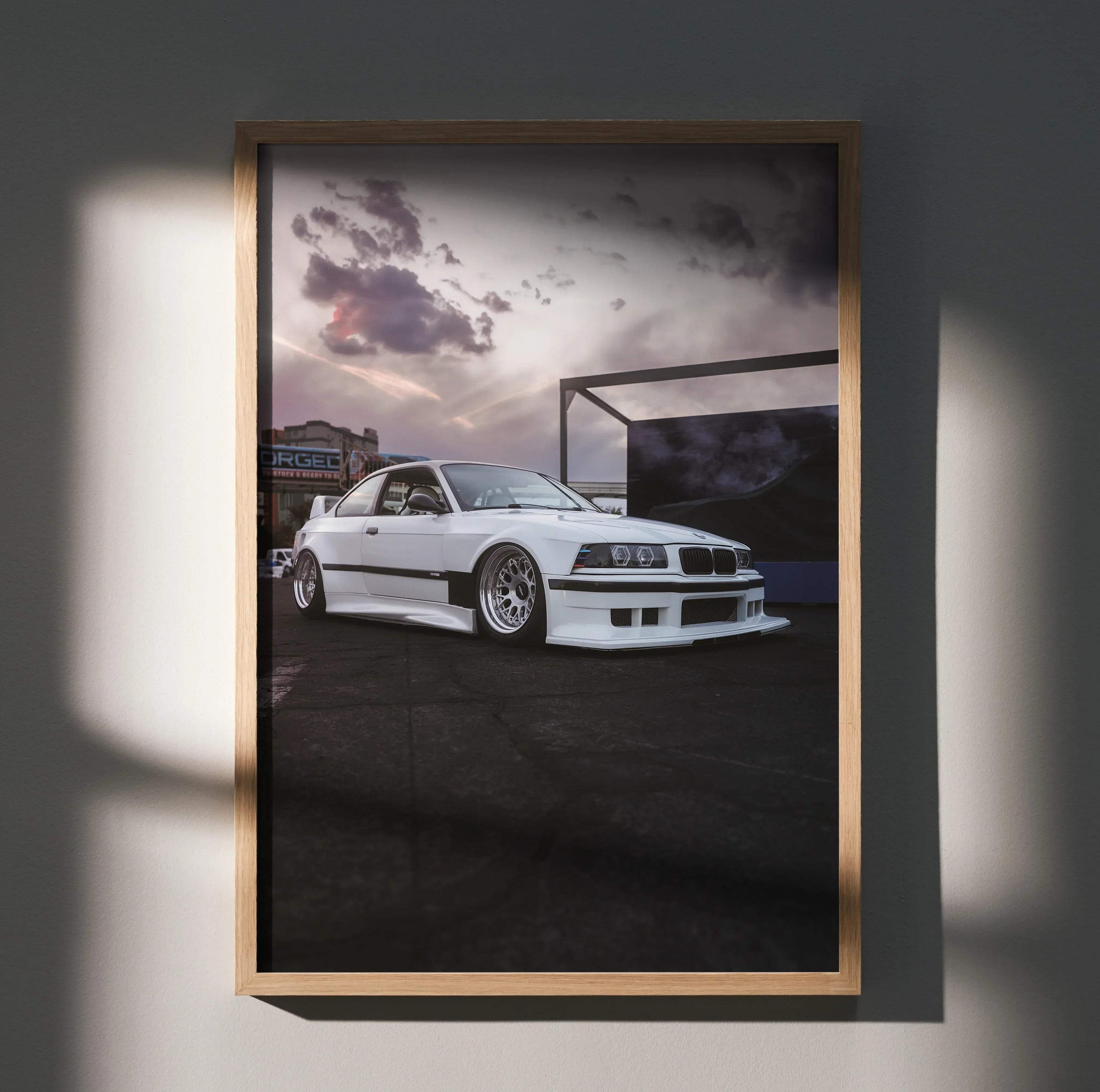 BMW E36 M3 poster wall art featuring a white sports car in a moody urban setting.