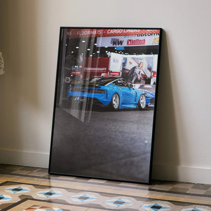 Nissan Z (RZ34) poster featuring bright blue car with automotive branding wall art in black frame.