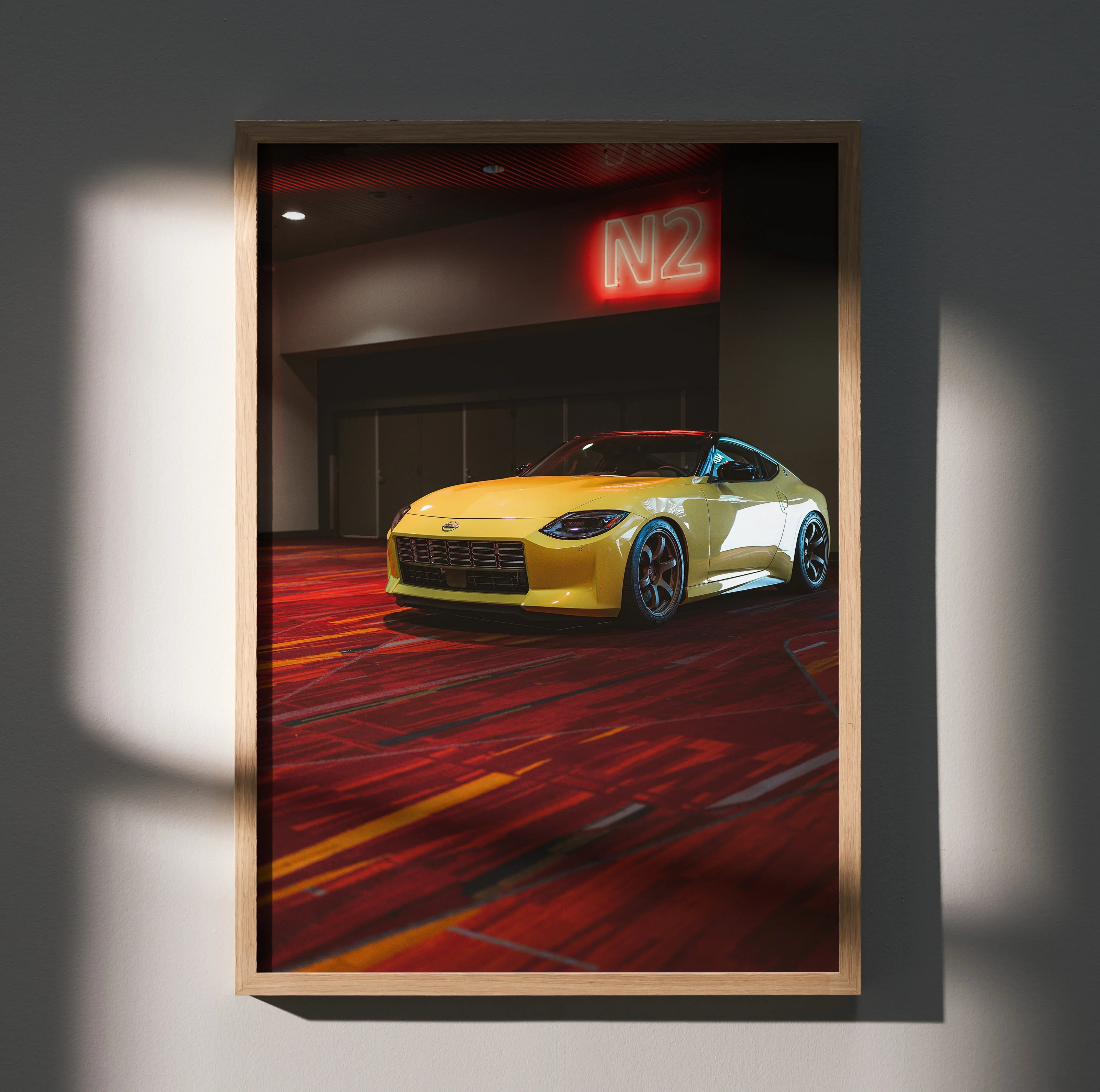 Nissan Z (RZ34) yellow sports car poster with dark garage and red neon M2 sign wall art.