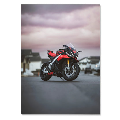 Aprilia RSV4 1100 Factory motorcycle poster with red and black sportbike on road under cloudy sky wall art.