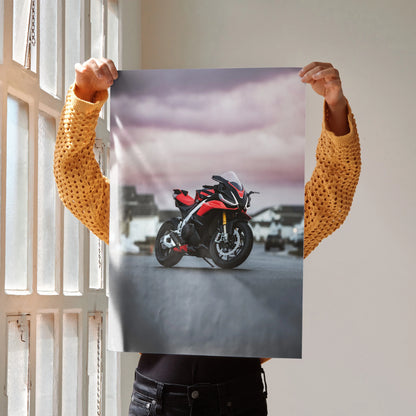 Poster of Aprilia RSV4 1100 Factory motorcycle with dramatic sky, sleek red and black design wall art.