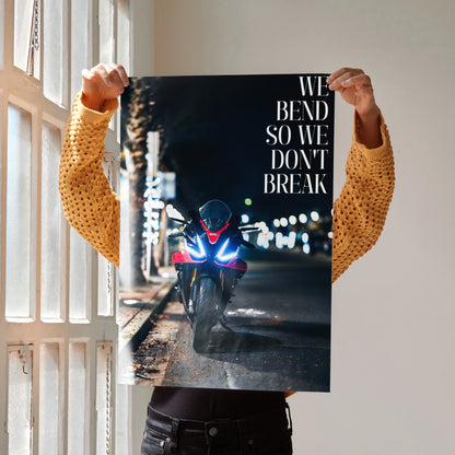 Motivational poster featuring Aprilia RSV4 1100 Factory motorcycle with "We Bend So We Don’t Break" quote at night wall art.