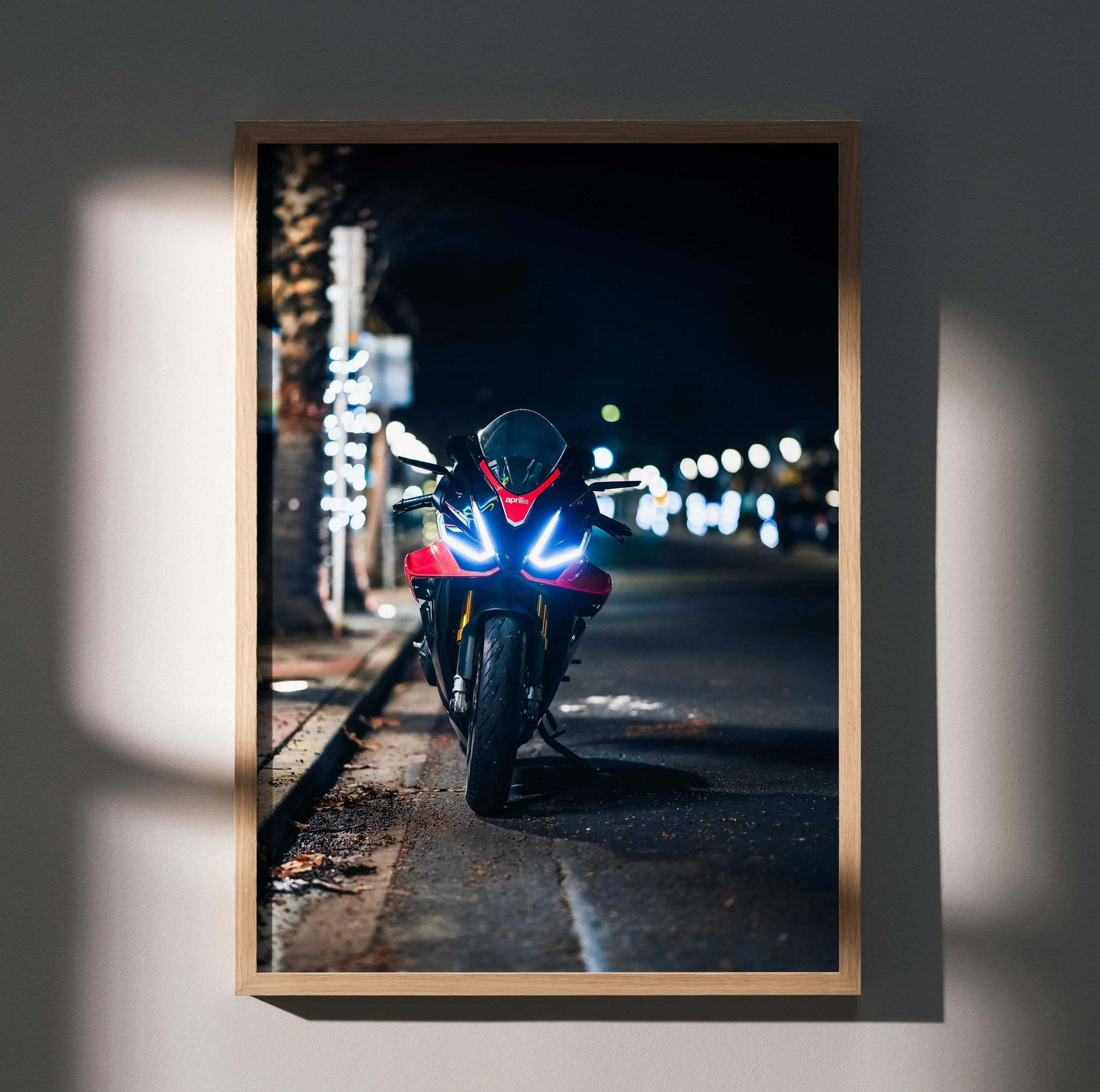 Aprilia RSV4 1100 Factory motorcycle wall art poster with illuminated headlights at night.