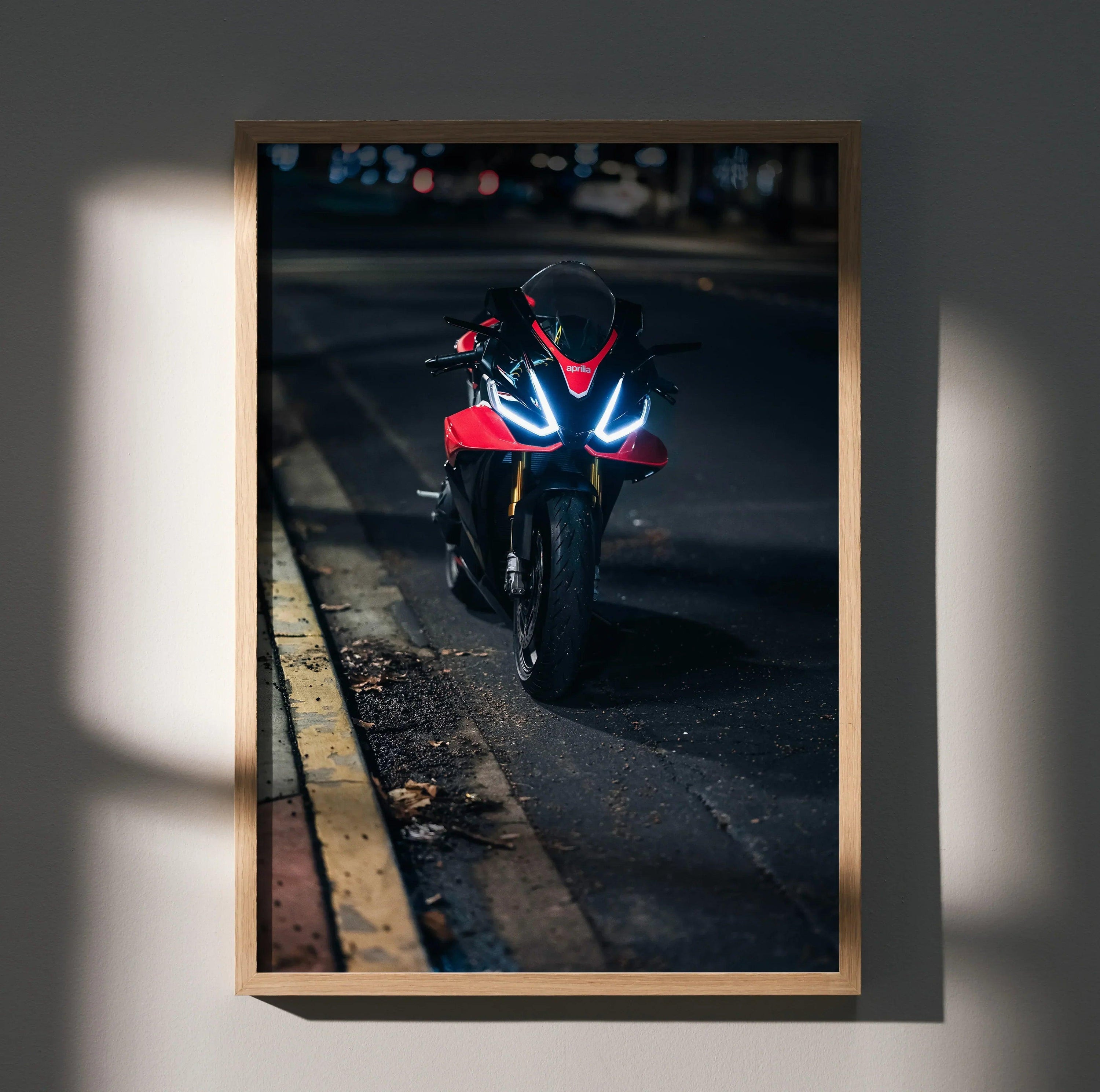 RSV4 1100 Factory motorcycle wall art poster with glowing headlights in dark urban setting.