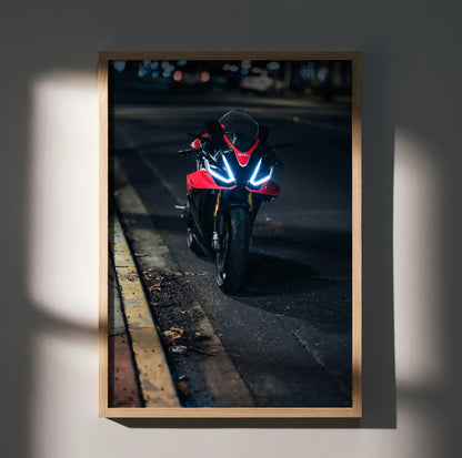 RSV4 1100 Factory motorcycle wall art poster with glowing headlights in dark urban setting.