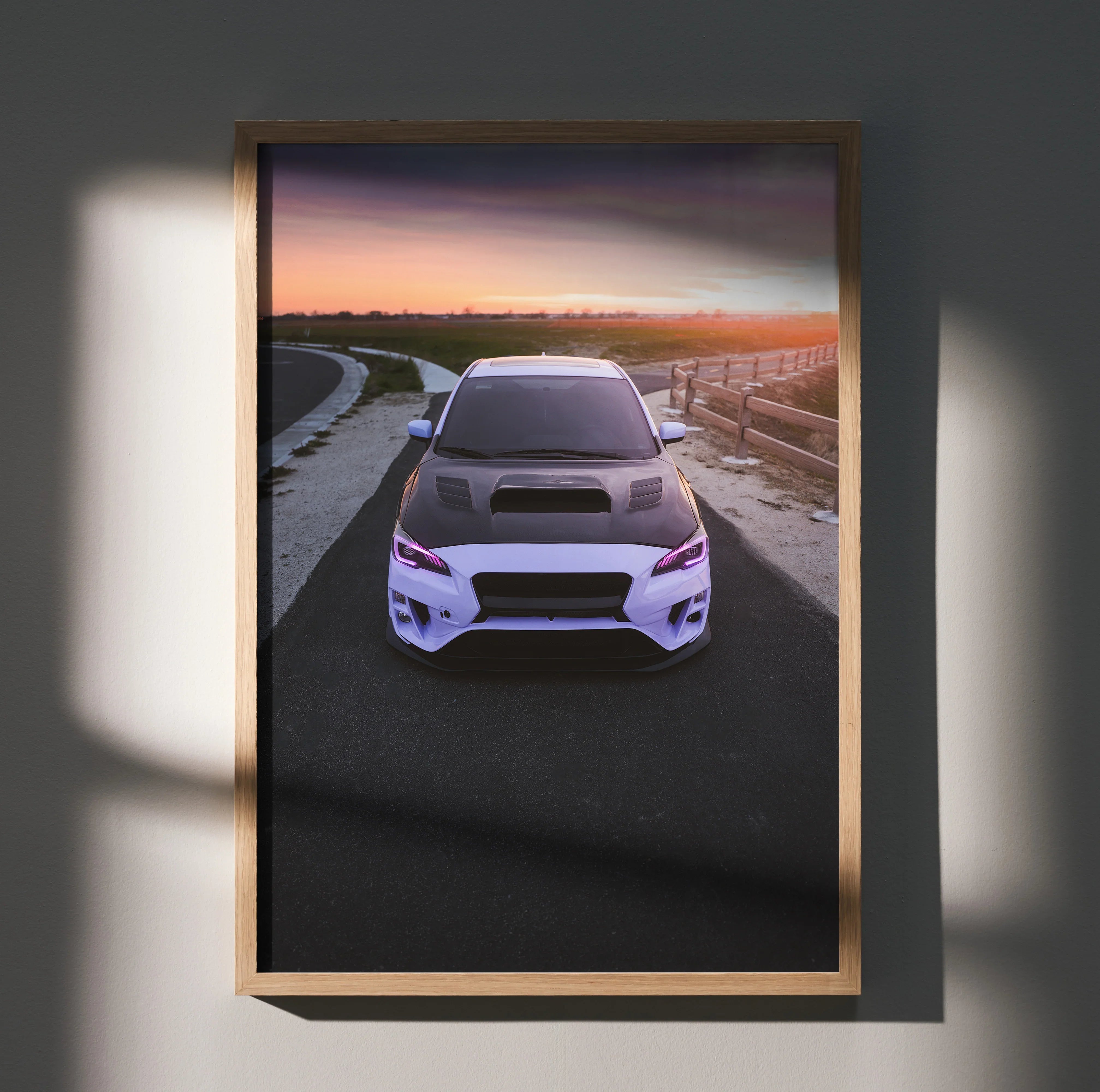Subaru WRX front view poster with sunset road background framed wall art.