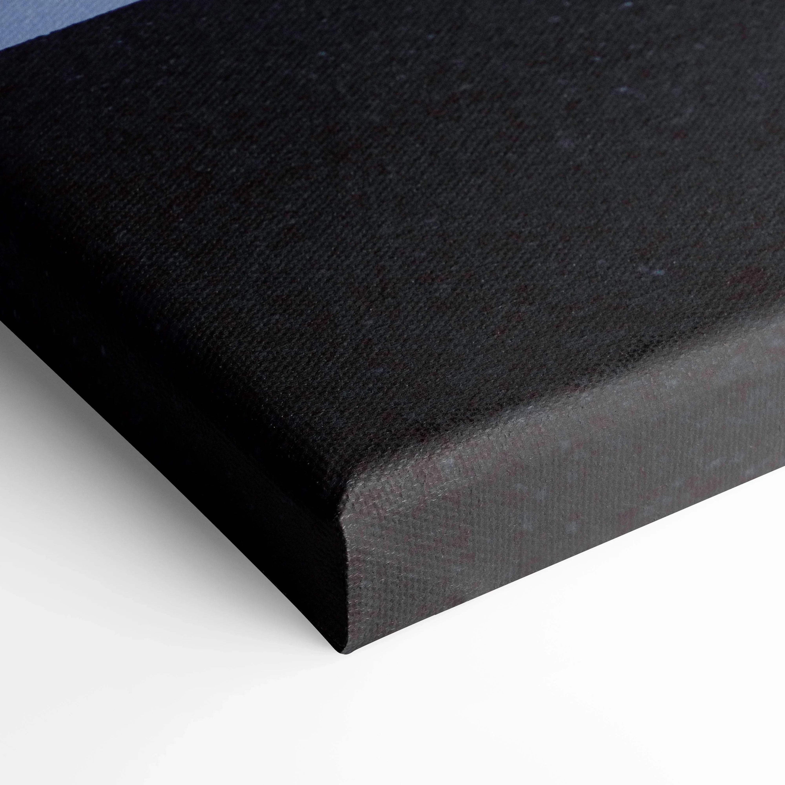 Black canvas wall art corner with textured fabric and tight stretched edges.