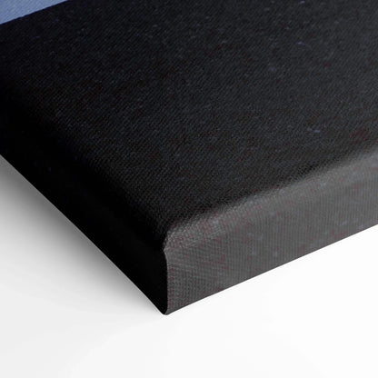 Black canvas wall art corner with textured fabric and tight stretched edges.