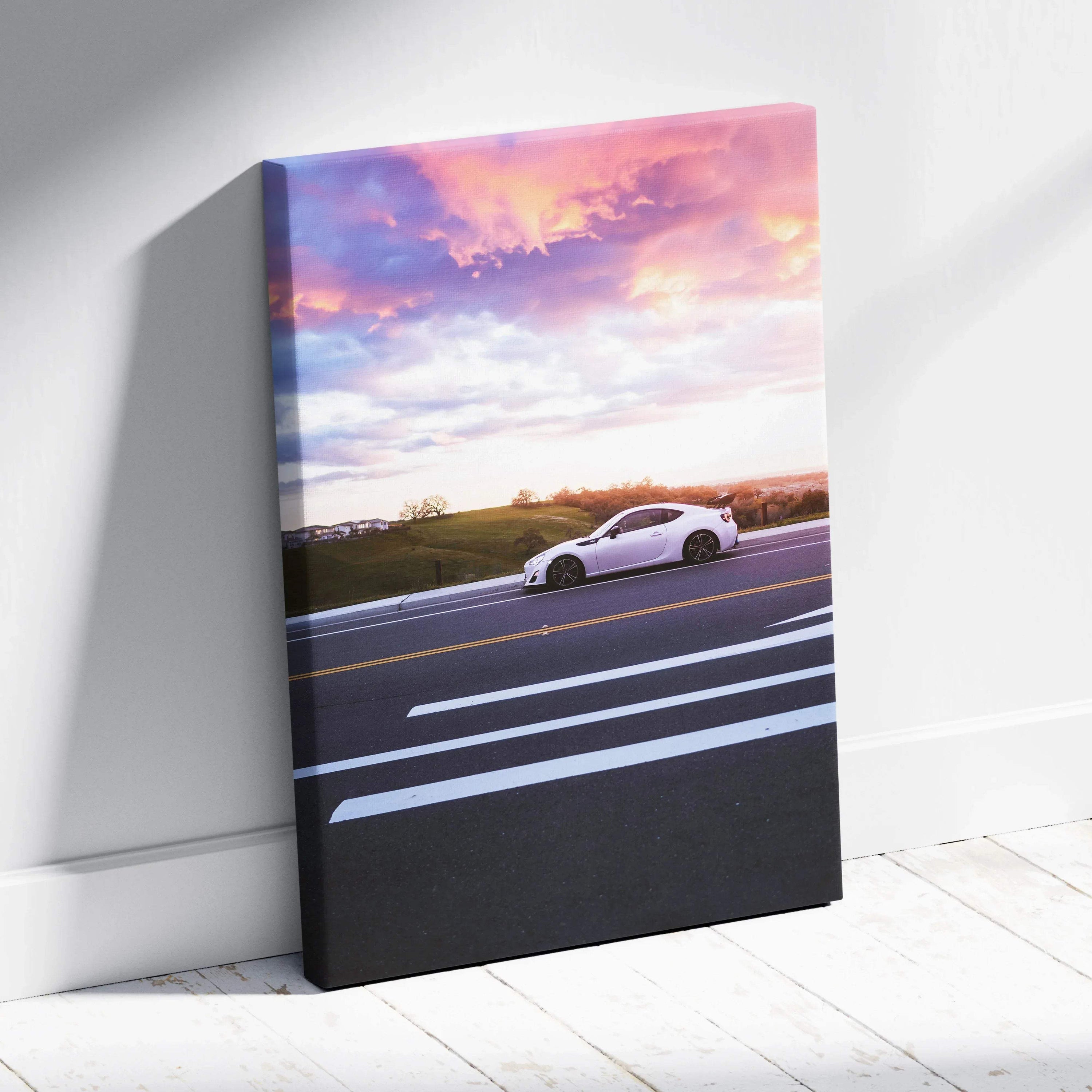 Toyota FRS driving at sunset on canvas vertical wall art with vibrant sky colors.