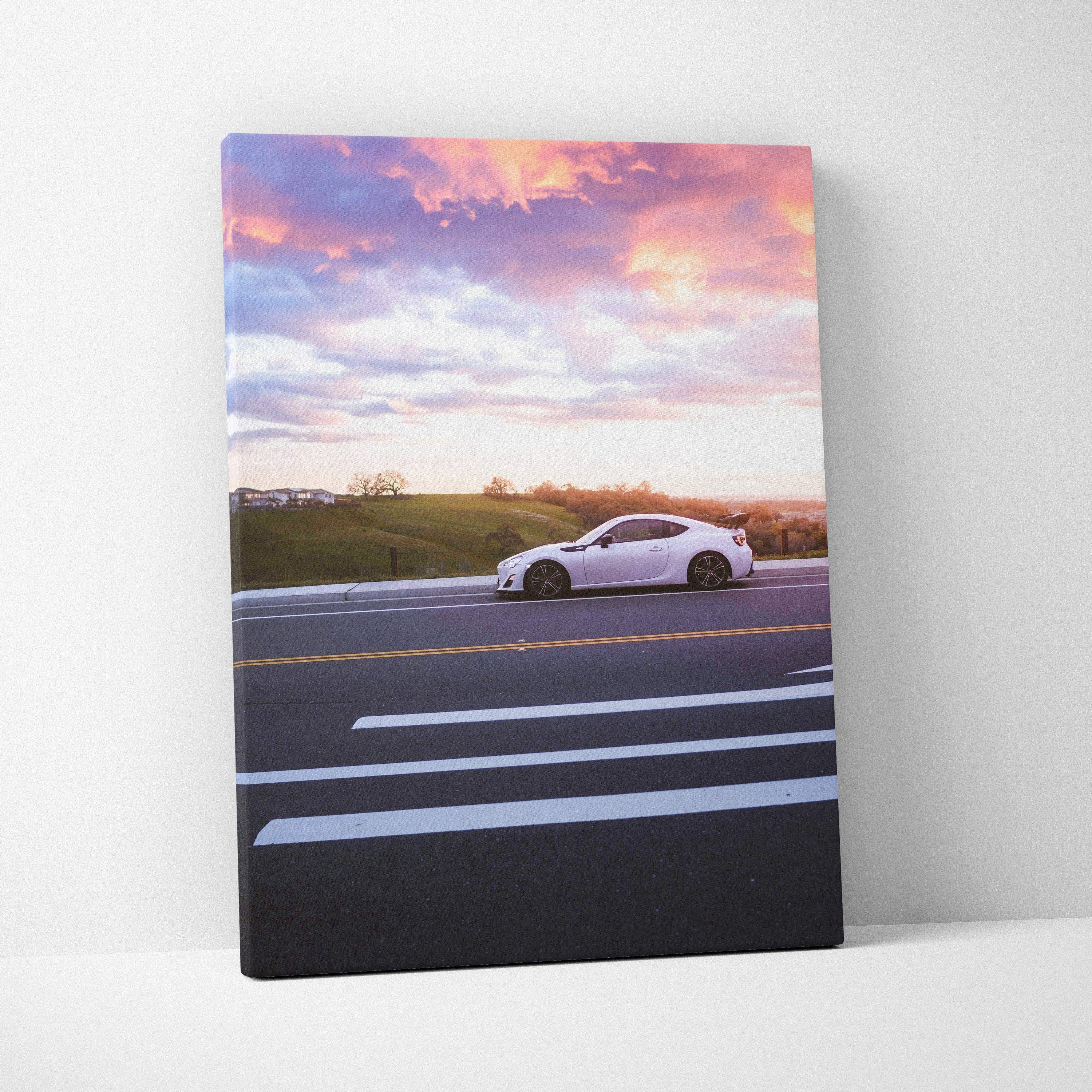 Toyota FRS white car on road with vibrant sunset sky canvas wall art.