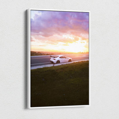 Vertical canvas wall art of a white Toyota FRS on a road at sunset with vibrant purple and orange sky.