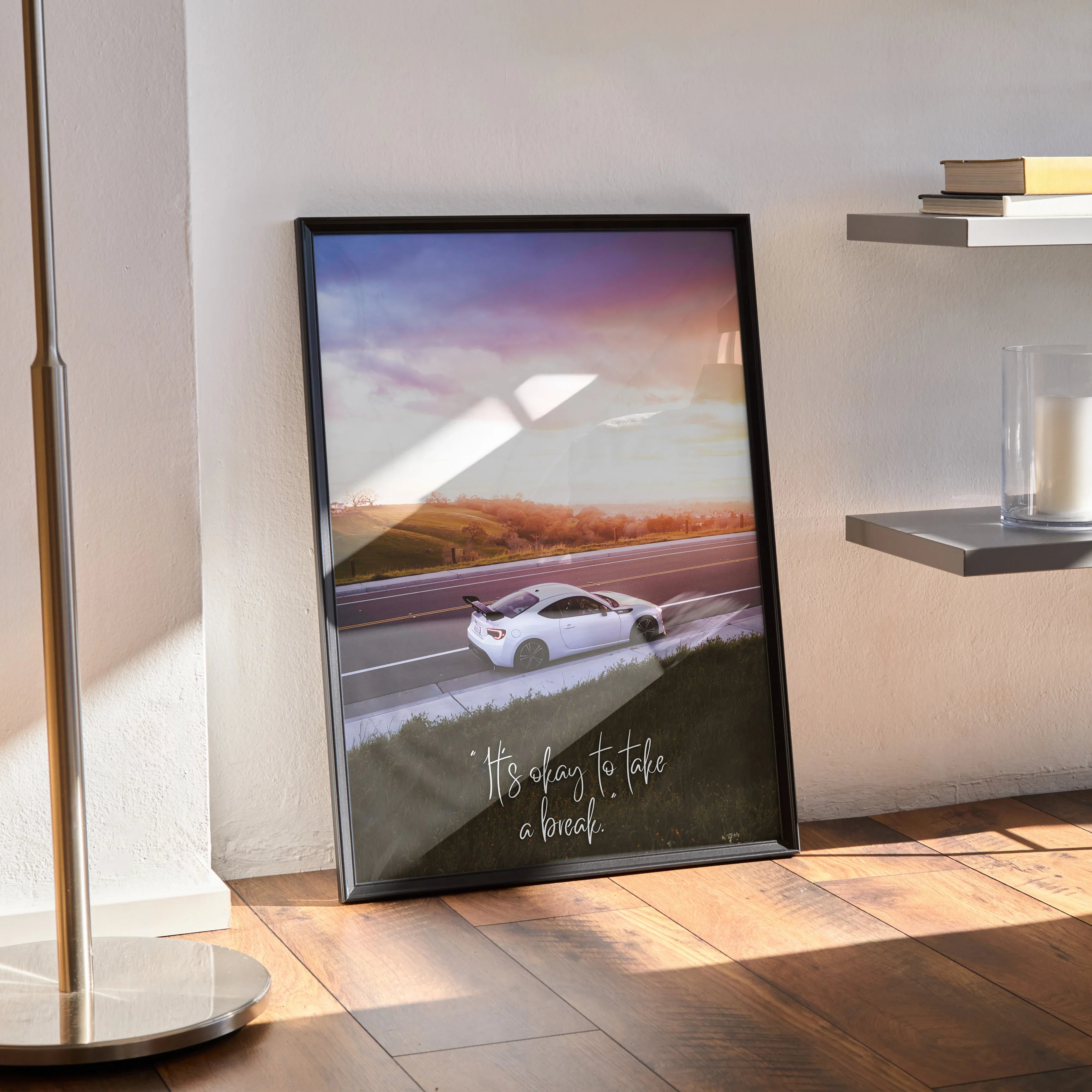Toyota FRS motivational poster wall art with car and inspiring text in black frame on floor.