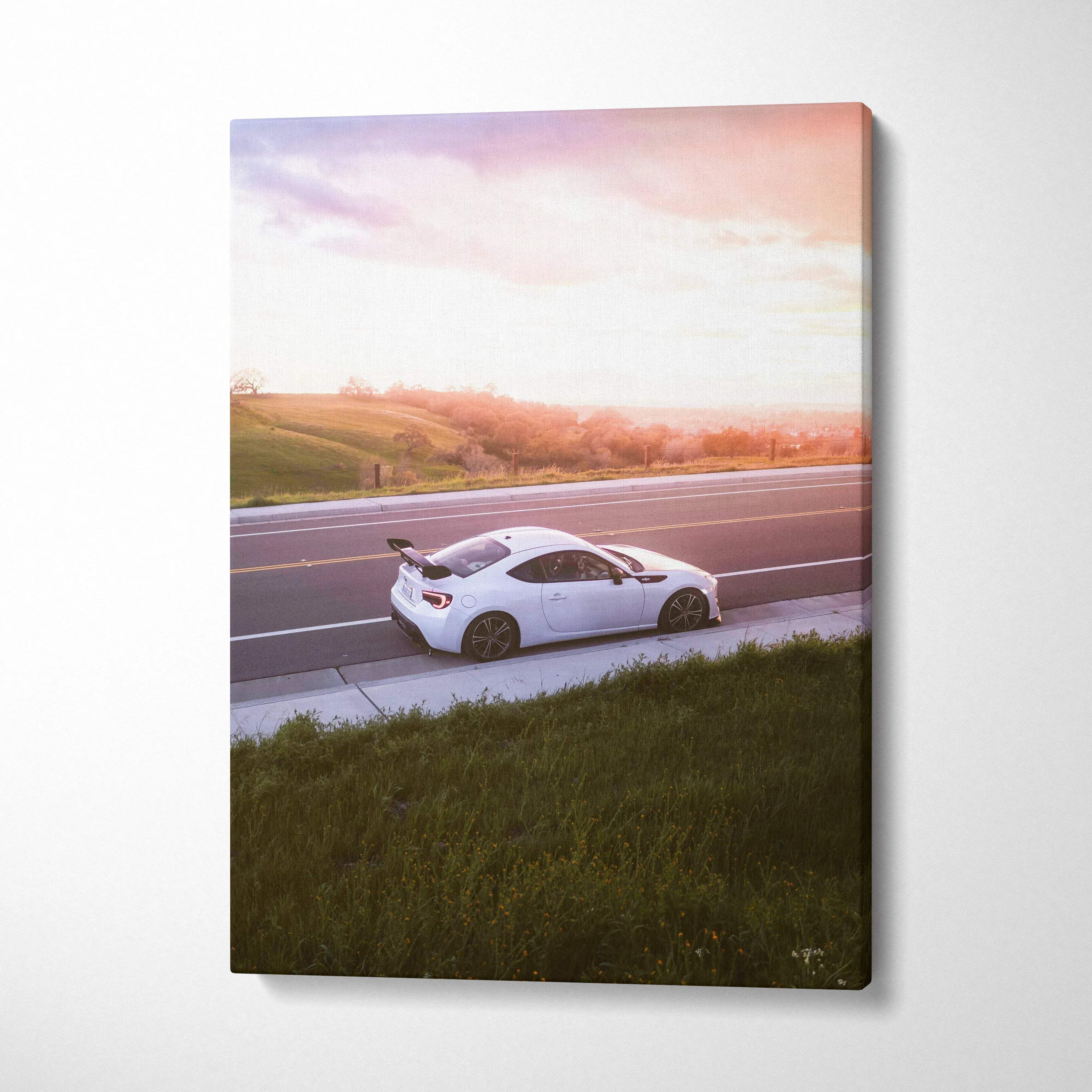 Toyota FRS white sports car driving on road at sunset wall art canvas print vertical.