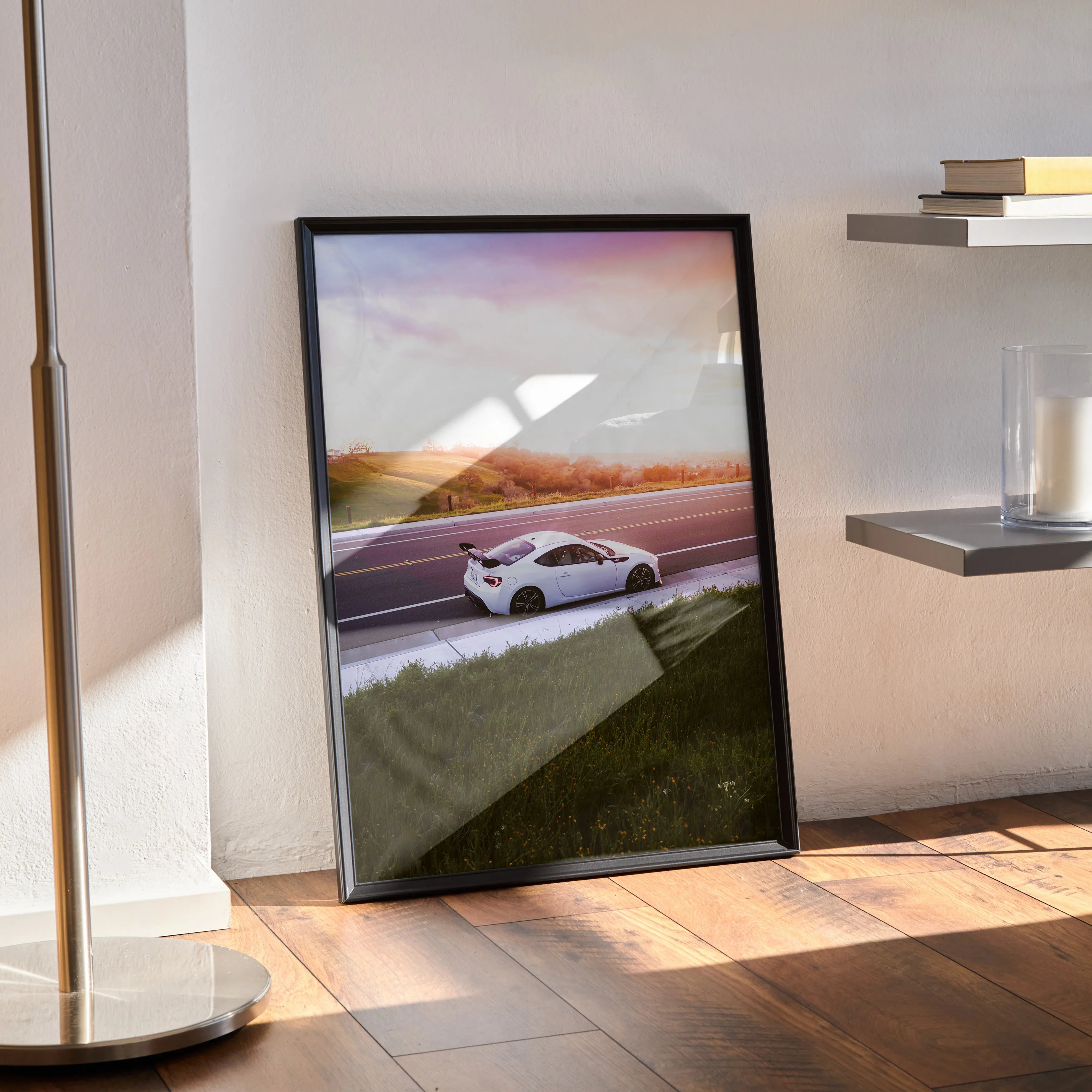 Toyota FRS poster with sunset background and sleek white sports car, modern wall art in black frame.