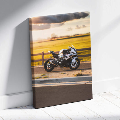 Vertical canvas wall art featuring a BMW S1000RR motorcycle against a sunset sky and open road background.