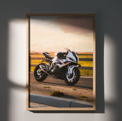 BMW S1000RR motorcycle poster with sunset background, premium wall art in wooden frame.