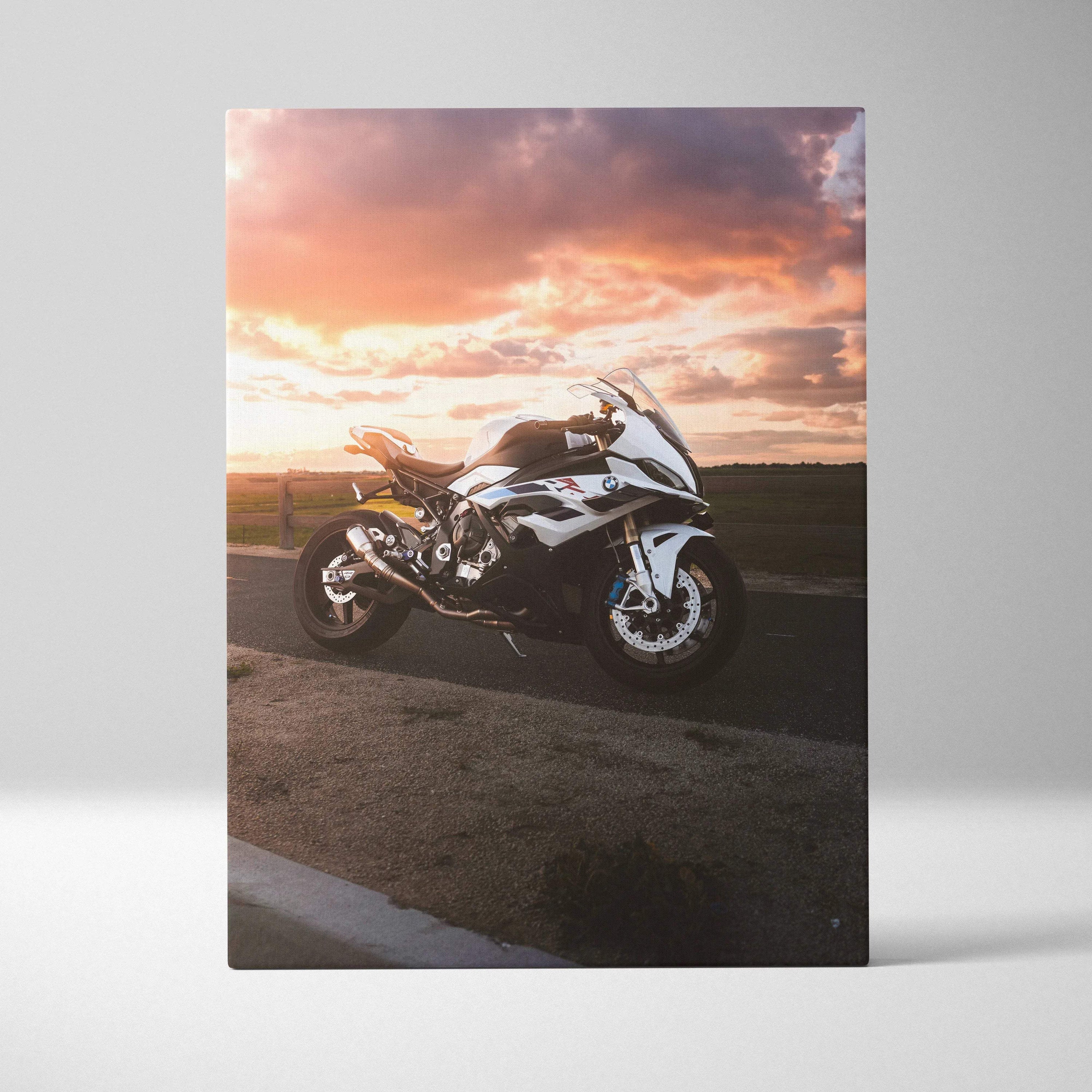 BMW S1000RR motorcycle at sunset on vertical canvas wall art with vibrant sky and road details.