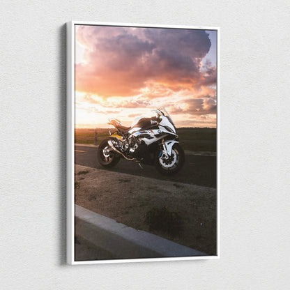 BMW S1000RR motorcycle at sunset on vertical canvas wall art with vibrant sky colors.