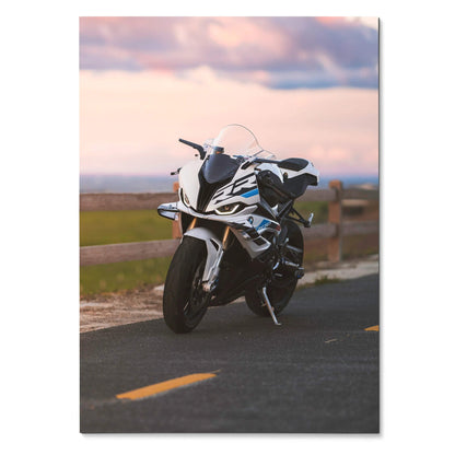 BMW S1000RR motorcycle poster with white and blue sportbike on road at sunset, premium wall art.