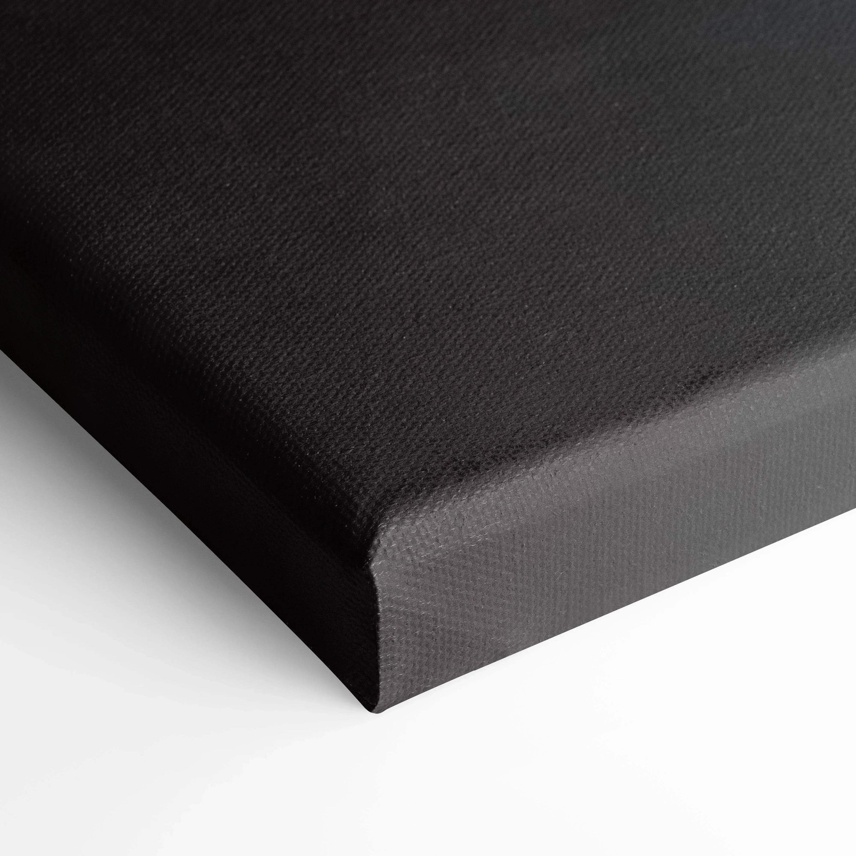 Black gallery-wrapped canvas edge with textured surface for premium wall art display.