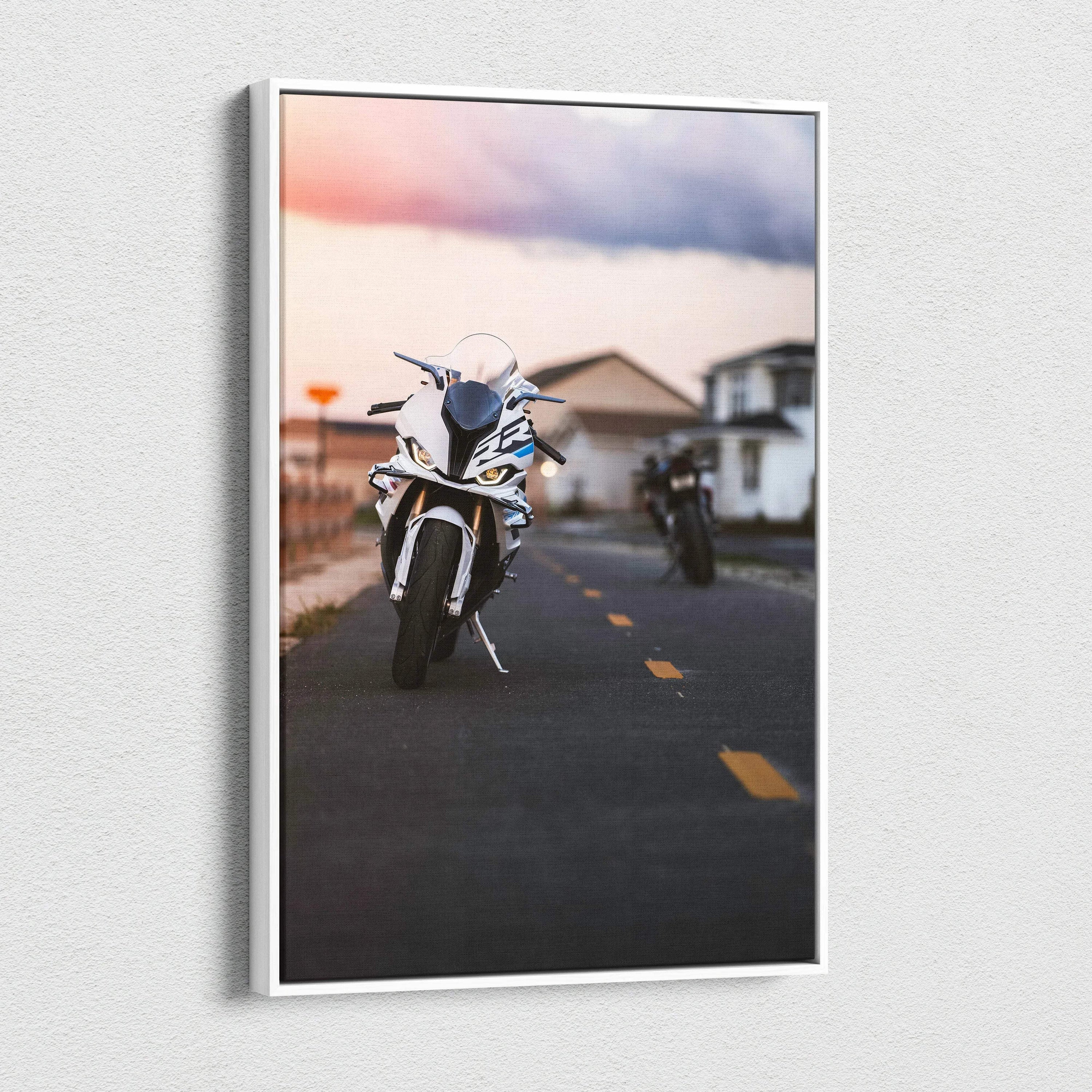 Vertical canvas wall art featuring a BMW S1000RR motorcycle on a road at sunset.