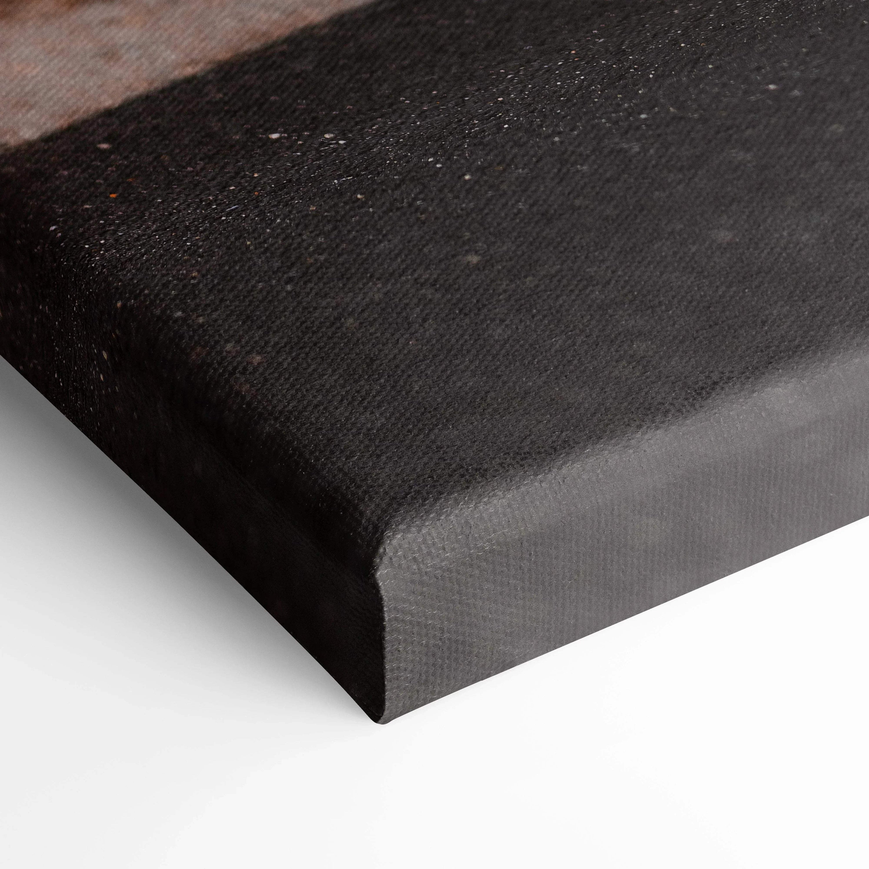 Close-up of black textured canvas edge showcasing high-quality wall art texture and finish.