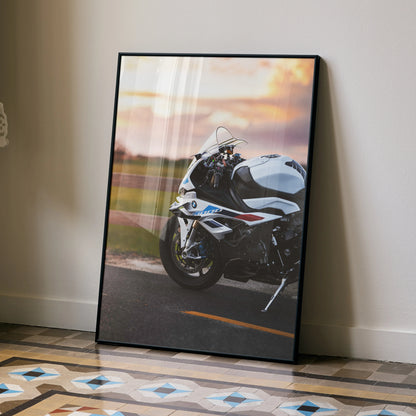 BMW S1000RR motorcycle wall art poster with sunset road background in a black frame.