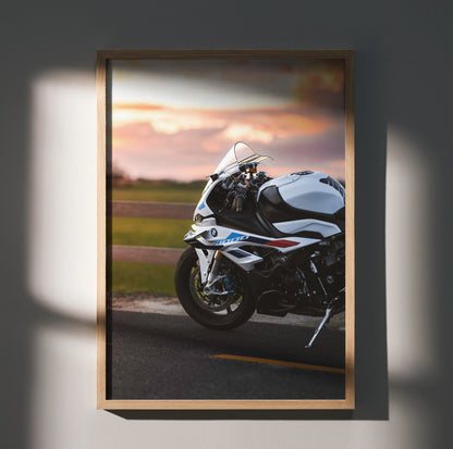 BMW S1000RR motorcycle on road at sunset poster wall art in wooden frame.