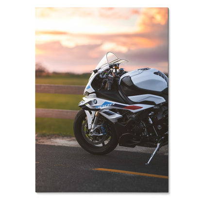 BMW S1000RR motorcycle poster featuring sleek white and blue sportbike with sunset background wall art.