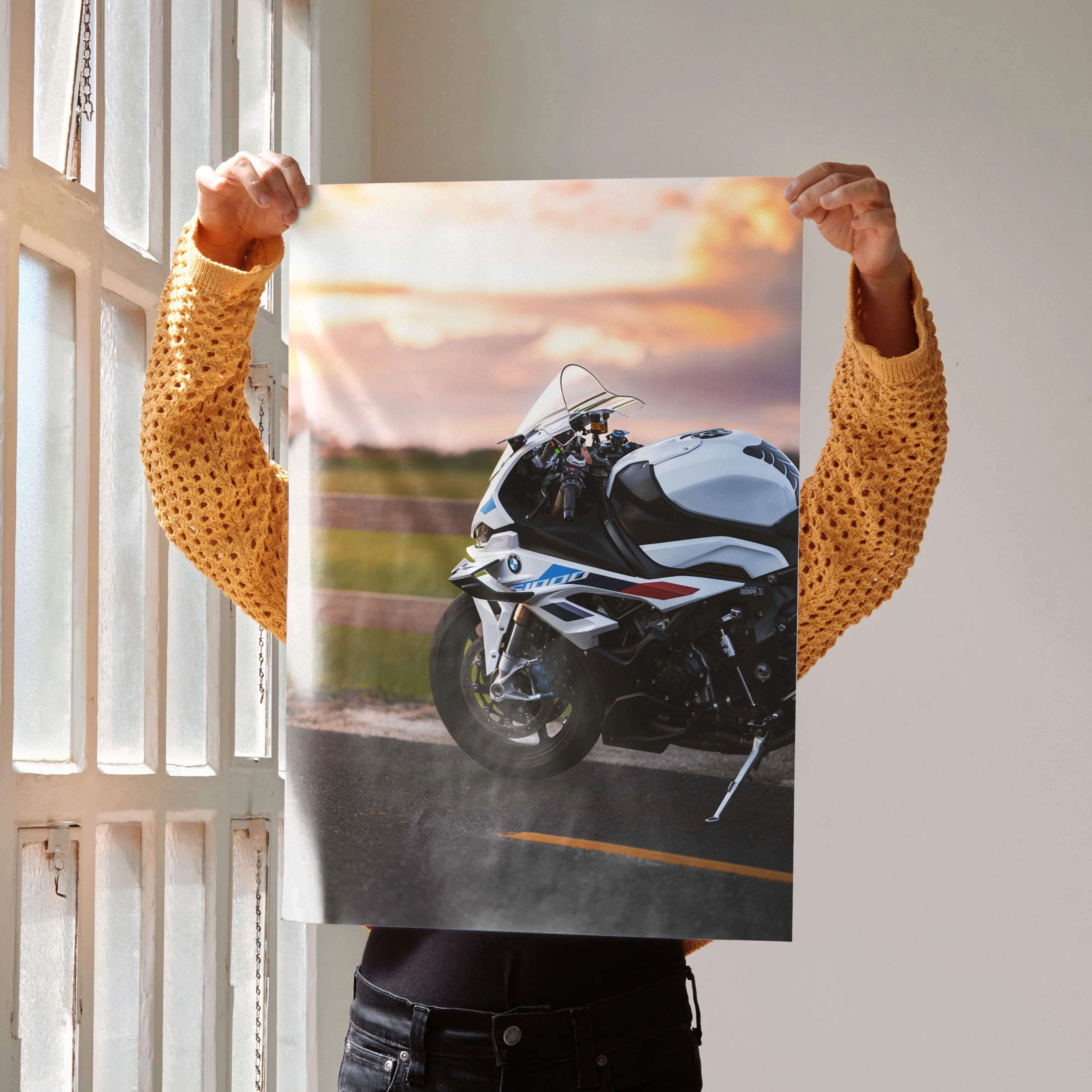 BMW S1000RR motorcycle poster with sunset background, sleek white and blue sportbike wall art.