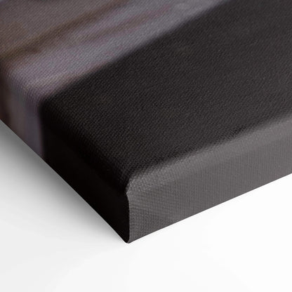 Close-up of black stretched canvas corner with textured surface for wall art display.