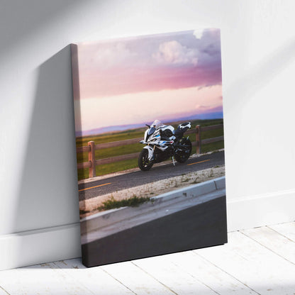 BMW S1000RR motorcycle at sunset on canvas wall art with vivid sky and road detail.