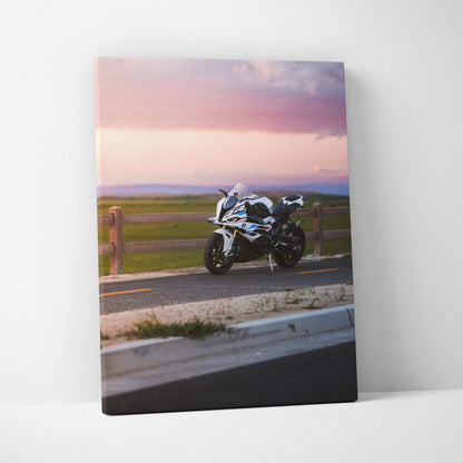 Vertical canvas wall art featuring a BMW S1000RR motorcycle against a sunset sky.