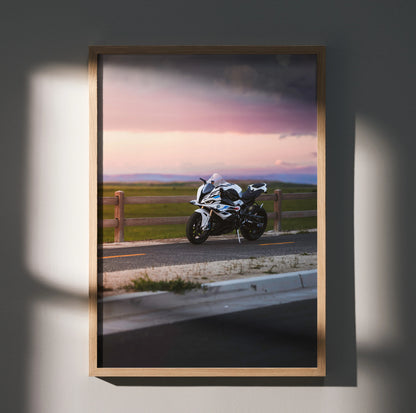 BMW S1000RR motorcycle poster wall art with sunset and rural road background in wooden frame.