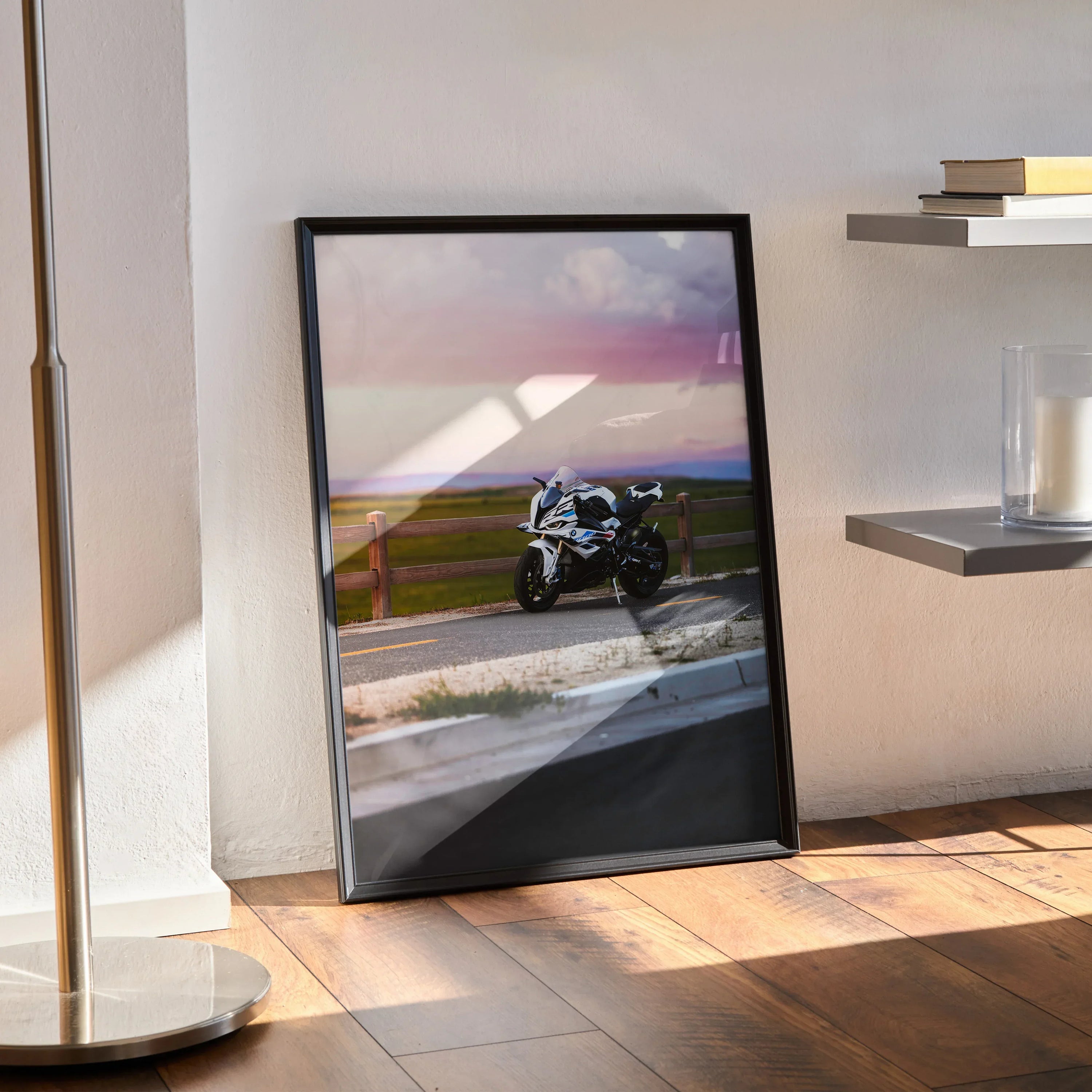 BMW S1000RR motorcycle poster with sunset background leaning against wall as modern wall art.