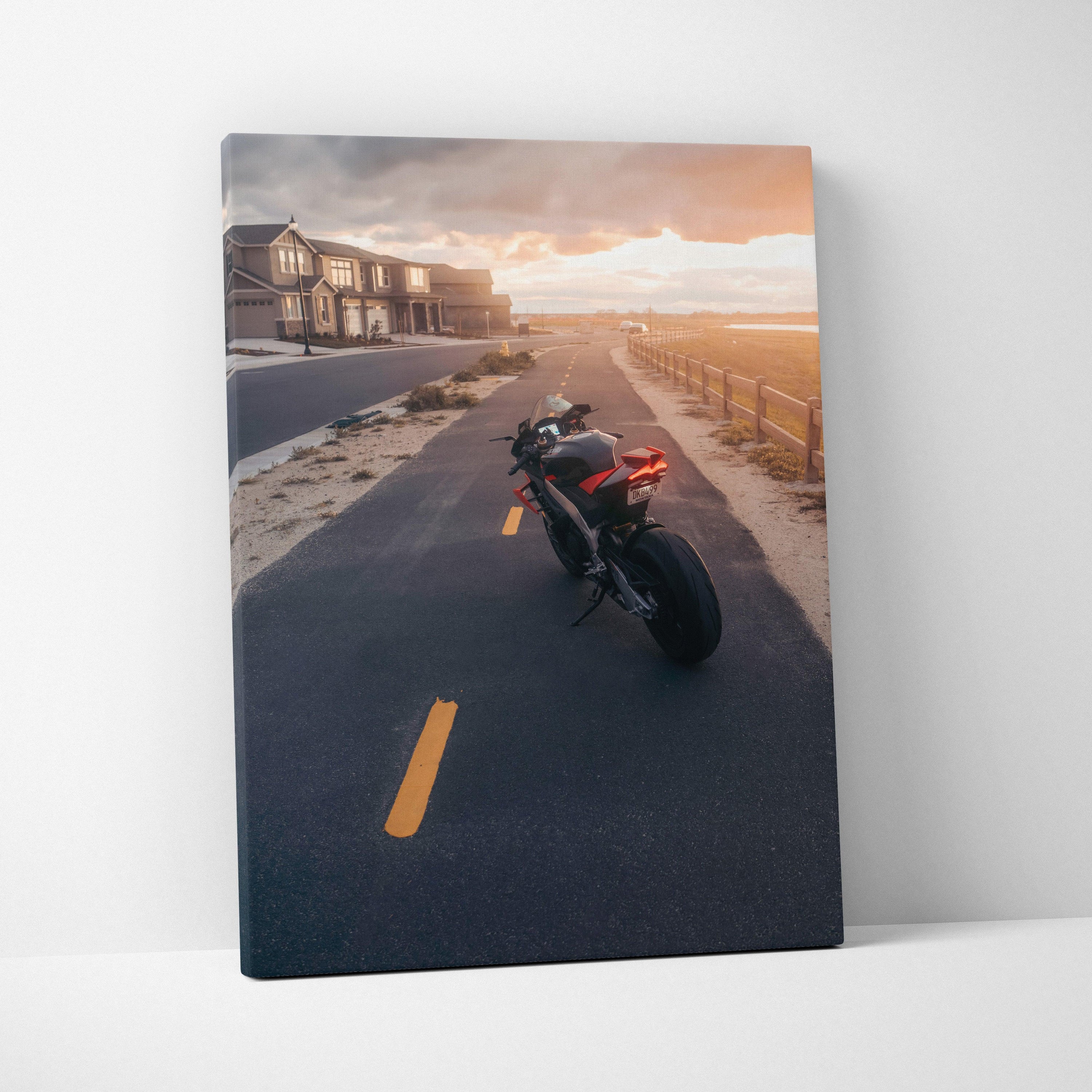 Aprilia RSV4 1100 Factory motorcycle on sunset road canvas wall art print.