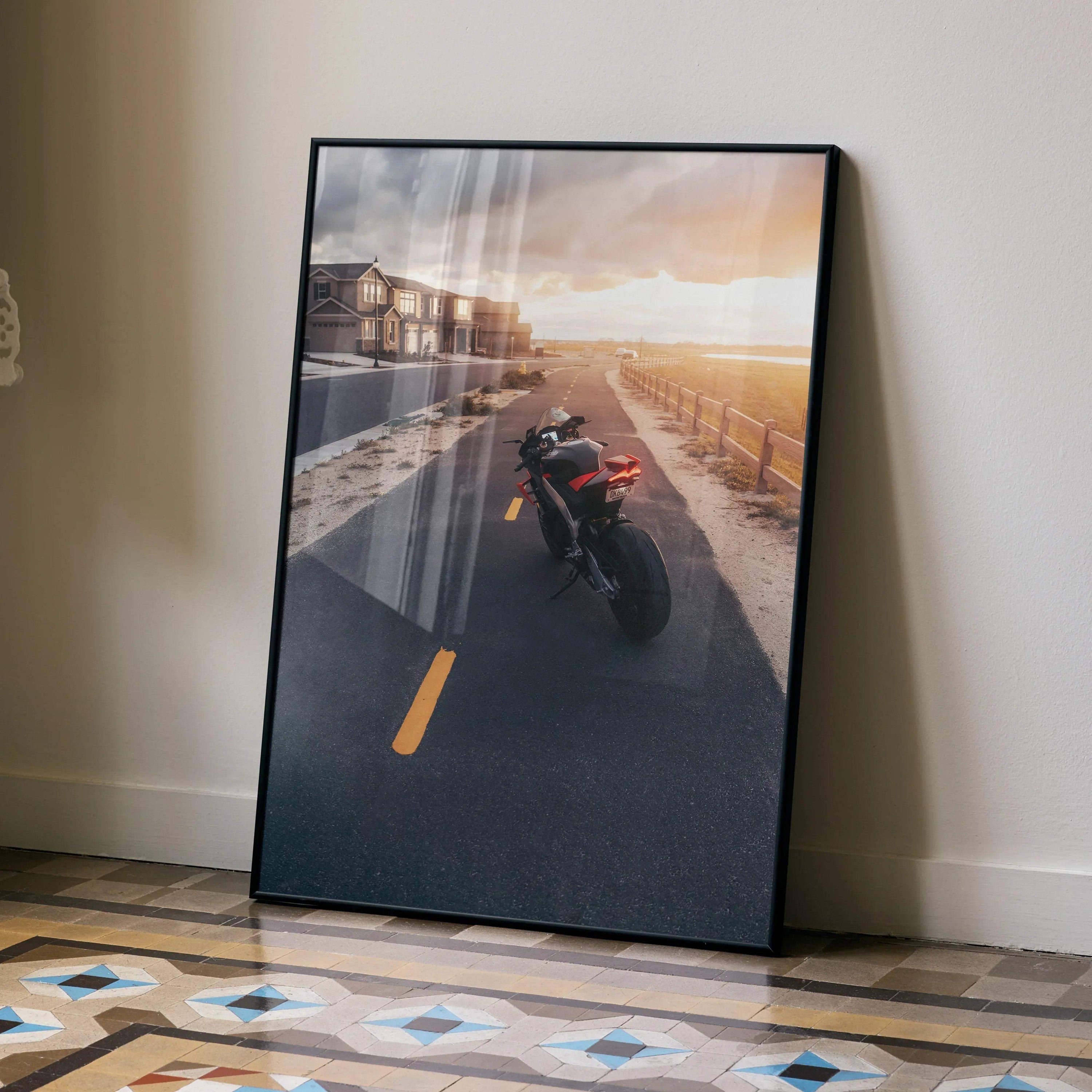 Aprilia RSV4 1100 Factory motorcycle poster with sunset road scene wall art in black frame.