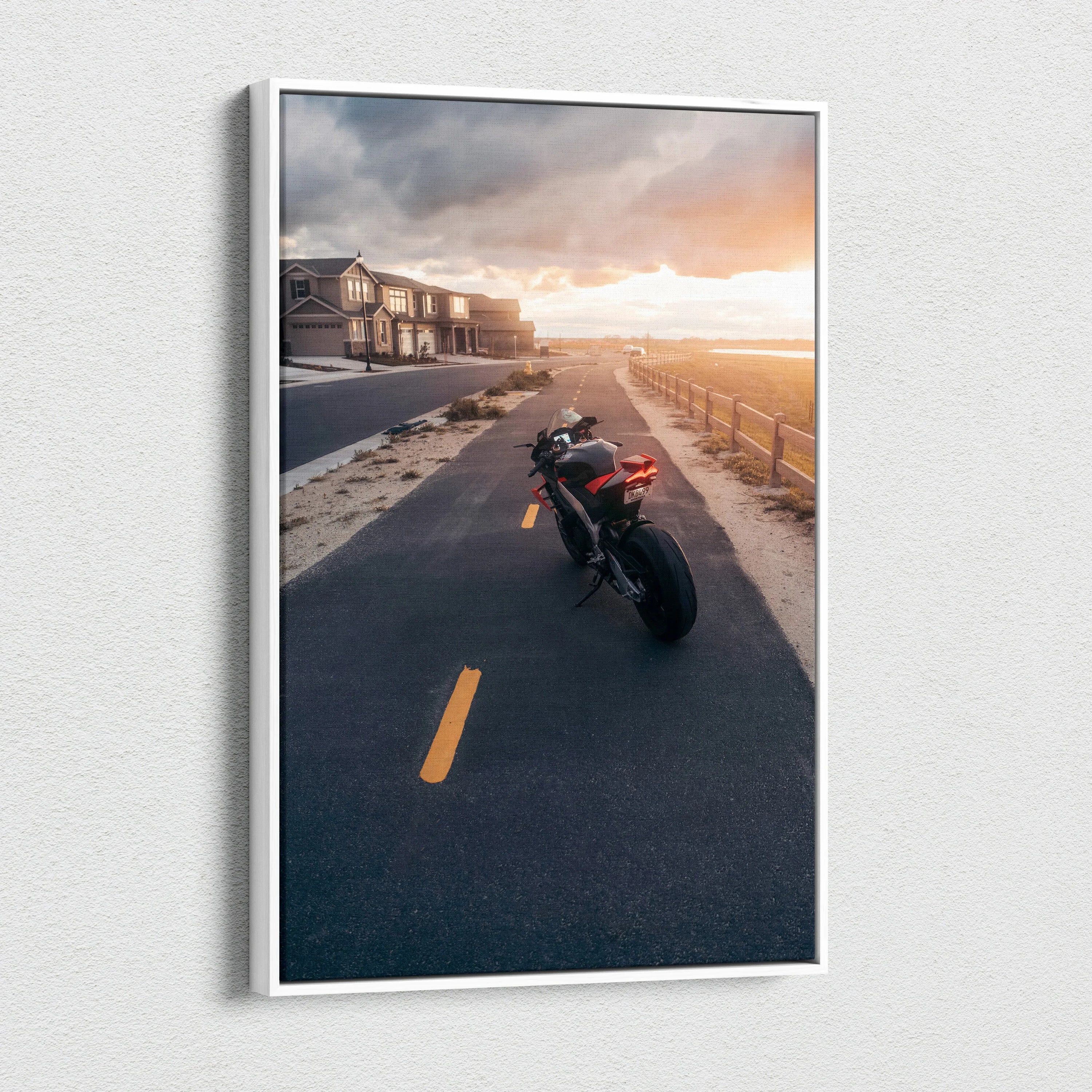 Vertical canvas wall art featuring Aprilia RSV4 1100 Factory motorcycle on sunset road.