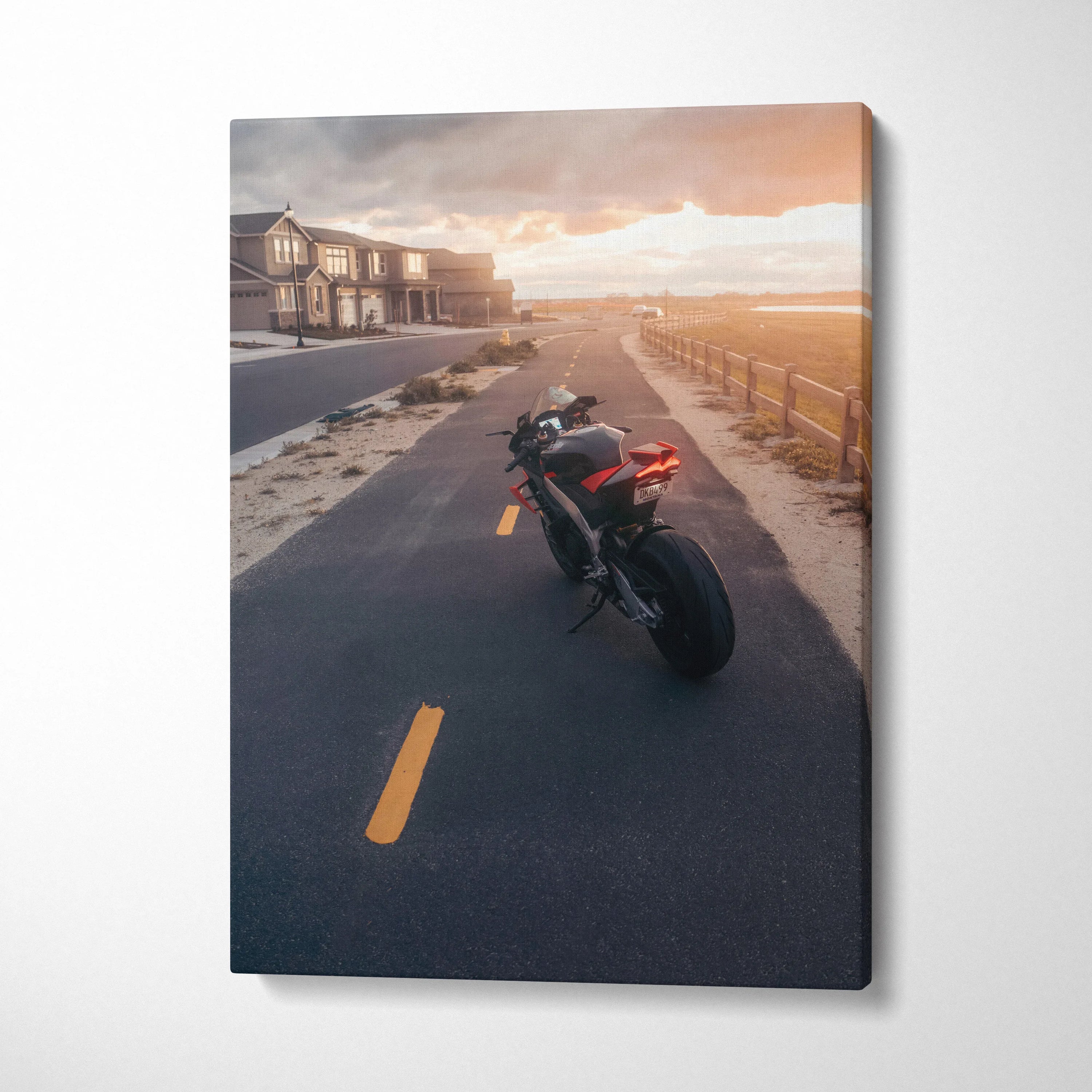 Aprilia RSV4 1100 Factory motorcycle on coastal road at sunset canvas wall art.