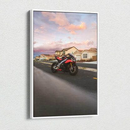 Aprilia RSV4 1100 motorcycle on road at sunset canvas wall art with vibrant sky and suburban houses.