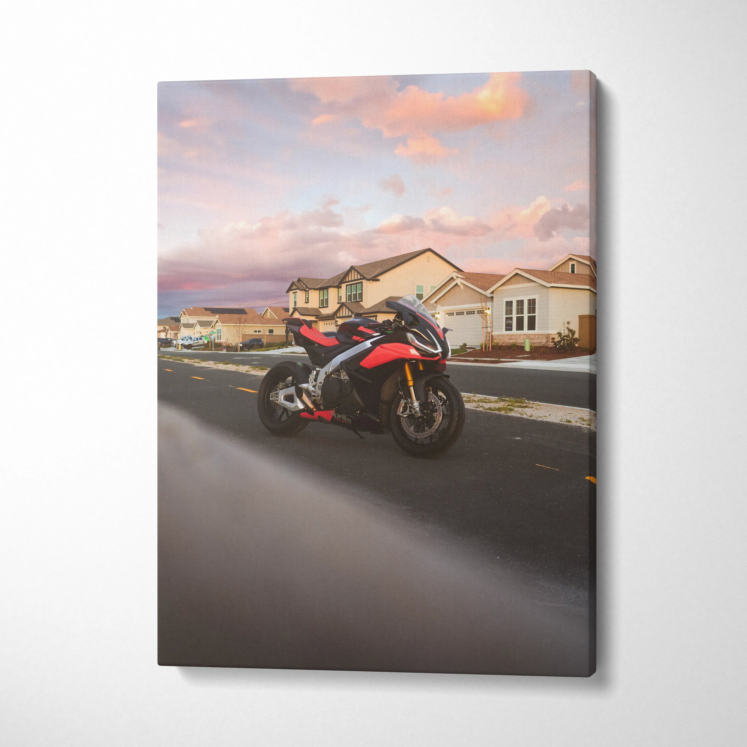 Aprilia RSV4 1100 Factory motorcycle on suburban road at sunset, vertical canvas wall art.
