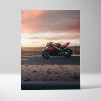 Aprilia RSV4 1100 Factory motorcycle silhouette at sunset on canvas wall art with warm sky tones.