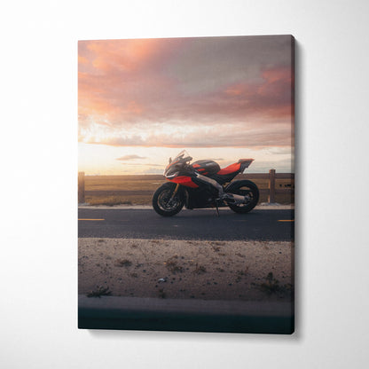 Aprilia RSV4 1100 Factory motorcycle on road at sunset Canvas wall art print.