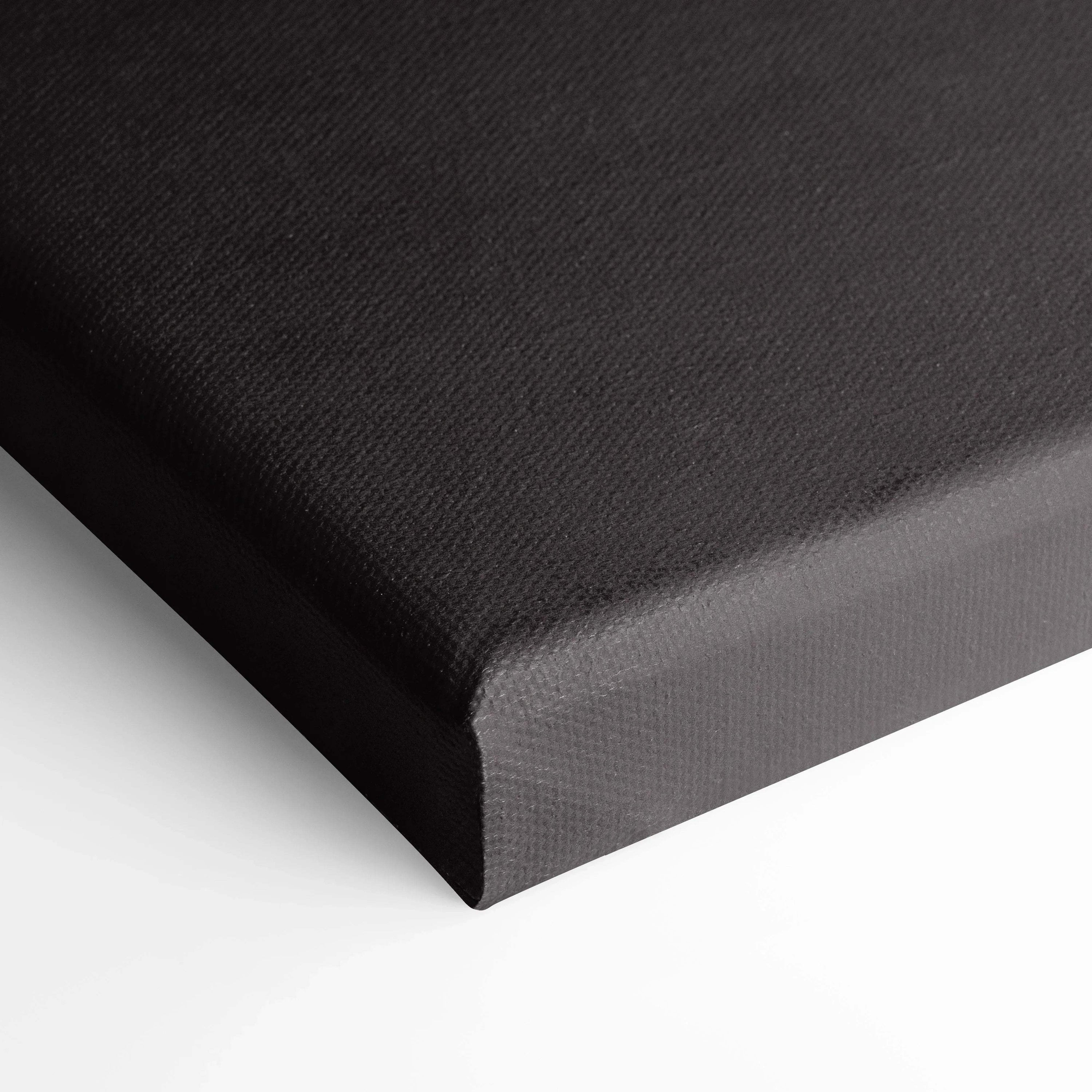 Close-up of black wrapped canvas edge showcasing texture for vertical wall art or car art print.