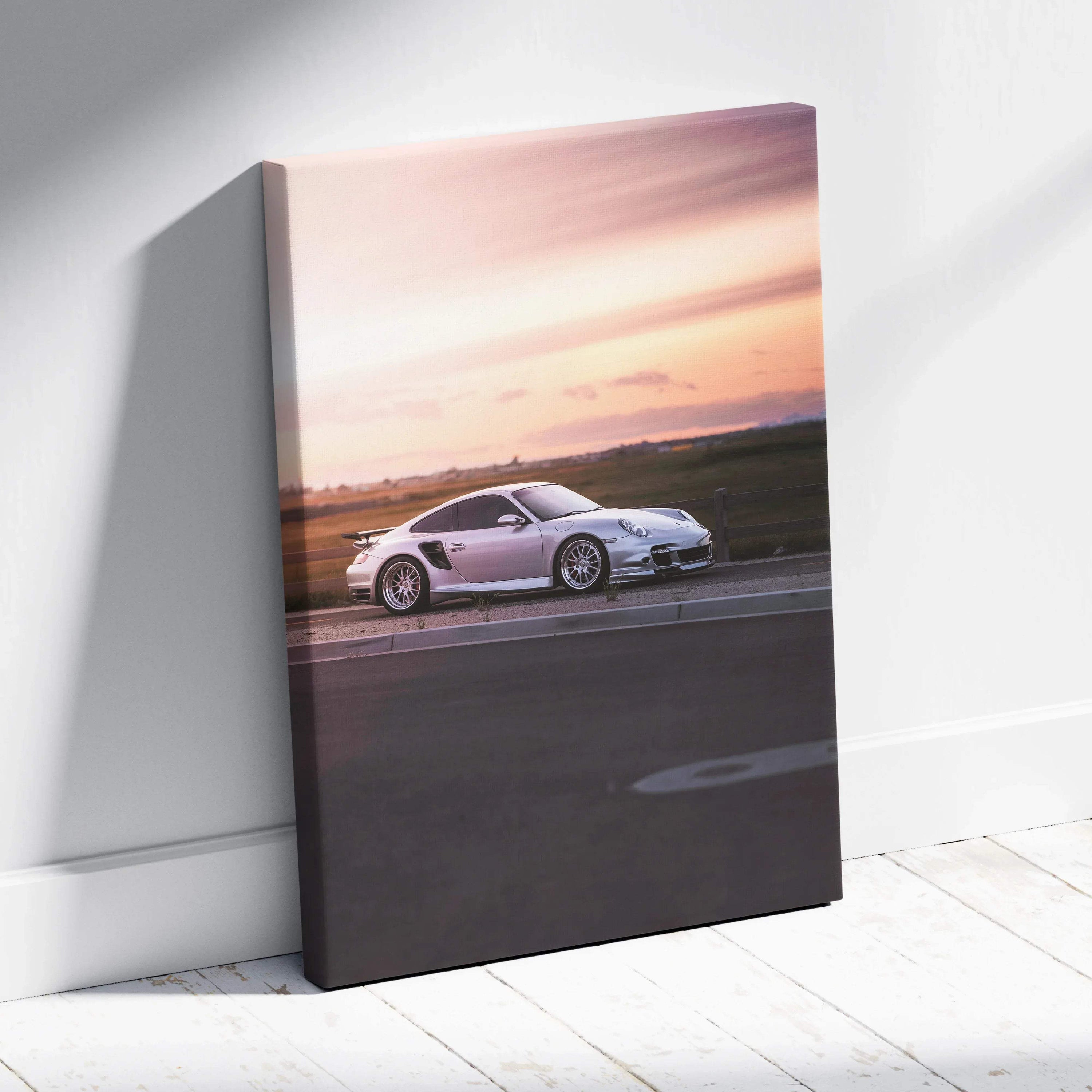 Porsche 911 Turbo on road at sunset canvas wall art with vibrant sky colors.