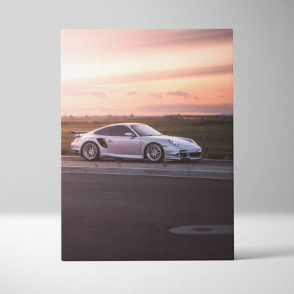 Porsche 911 Turbo car against a sunset sky on vertical canvas wall art.