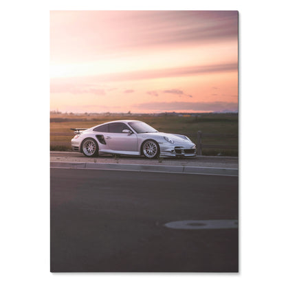 Porsche 911 Turbo in white parked on road at sunset with soft pink sky poster wall art.