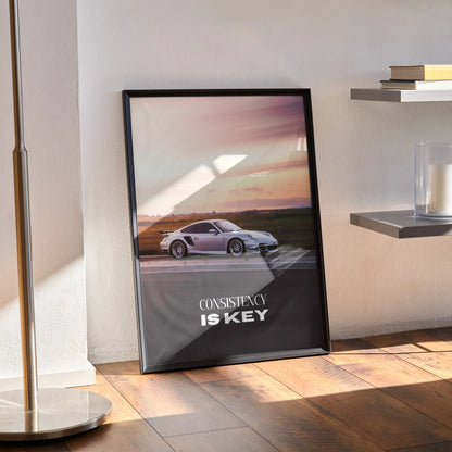 Porsche 911 Turbo motivational poster with "Consistency Is Key" text in black frame wall art.